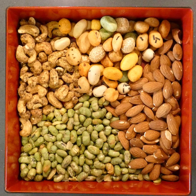 Dry snacks arranged as 'fukiyose' in a square box