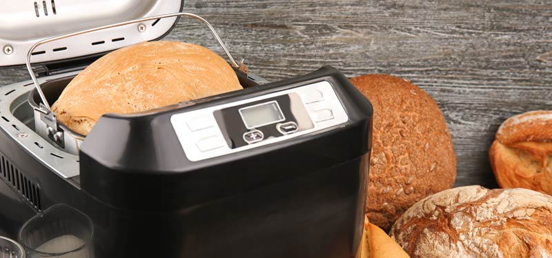Breadmaker with loaves of bread
