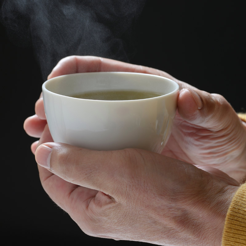 Japanese teacup held in hands