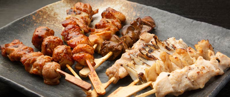 Yakitori chicken skewers on a plate