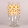 Glass footed tumbler with retro marguerite daisy design