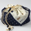 Cotton fabric bento bag with drawstring ties and stylish cat design