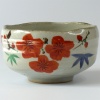 Japanese matchawan tea bowl with orange yamacha blossom design