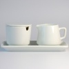 White ceramic sugar bowl and milk jug set