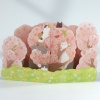 Pop up greetings card with cats sitting in pink cherry blossom trees