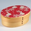 Traditional Japanese bento box with a cute rabbit and cherry blossom design on the lid