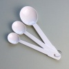 Set of three white enamel measuring spoons