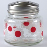 Glass storage jar with retro red and white floral design