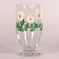 Glass footed tumbler with retro green and white daisy design
