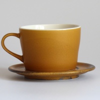 Caramel coloured Japanese cup and saucer