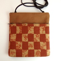 Small canvas handbag in brick orange with a check design