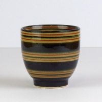 Black Japanese tea cup with red stripe pattern