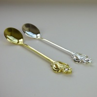 Royal Crown teaspoons in gold and silver