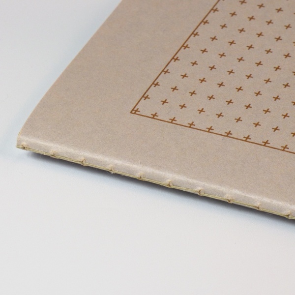 Close up of grey cover of grid notebook