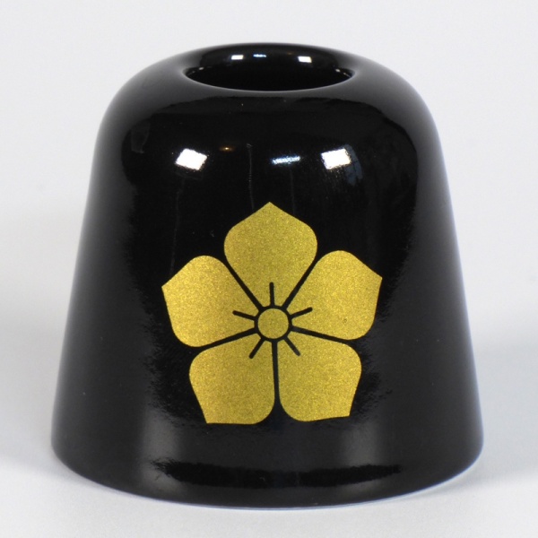 Black ceramic Japanese toothbrush holder with gold samurai crest