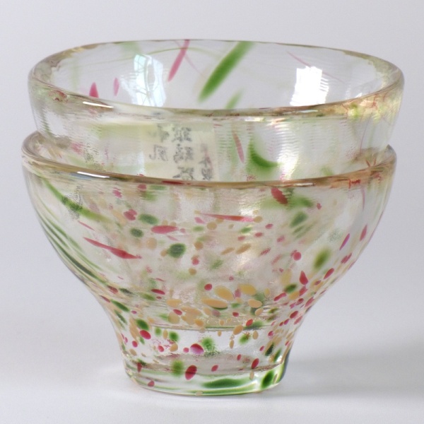 Two speckled glass Japanese sake cups