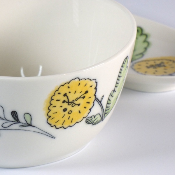 Close up of yellow aster design soup cup