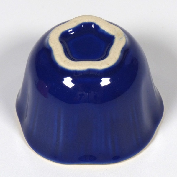 Underside of blue mini dish showing the blossom shape