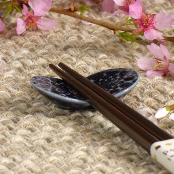 Dark blue ceramic Butterfly chopstick rest with chopsticks on table