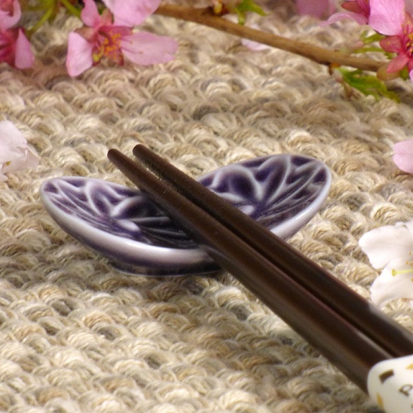 Purple ceramic Butterfly chopstick rest with chopsticks on table