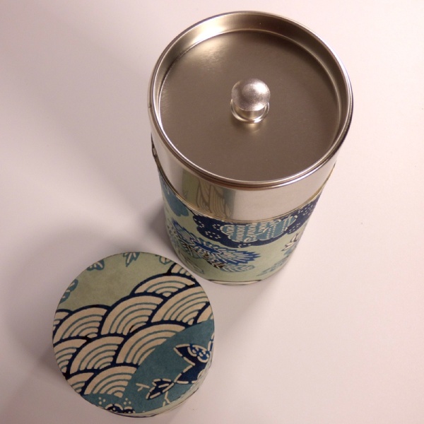 Inside of tall washi paper tea caddy with blue Aomi wave design