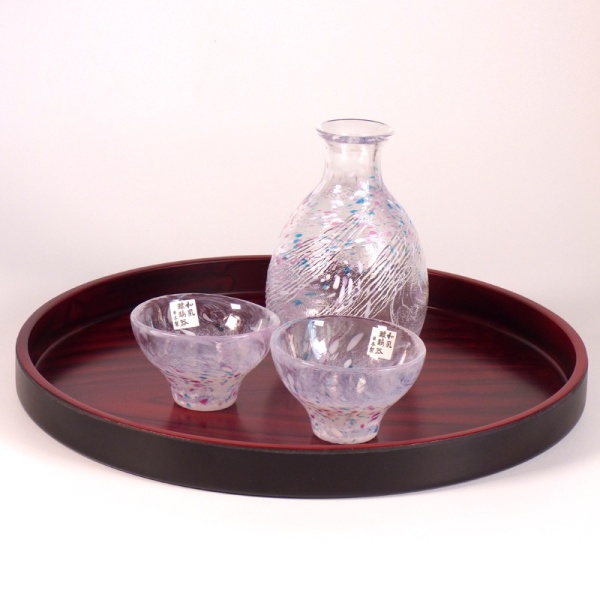 Round Japanese tray with sake jug and cups