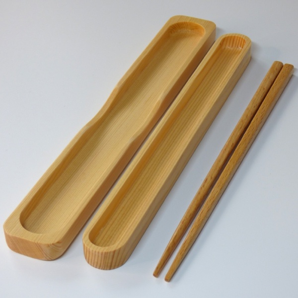 Wooden Japanese chopsticks next to open wooden box