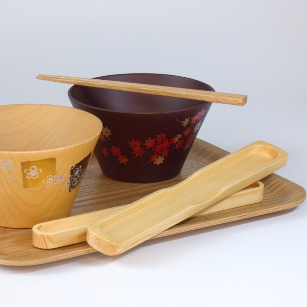 Wooden chopsticks with bowls on tray