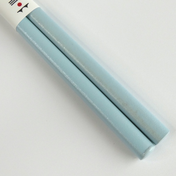 Close up of pastel blue chopstick handles