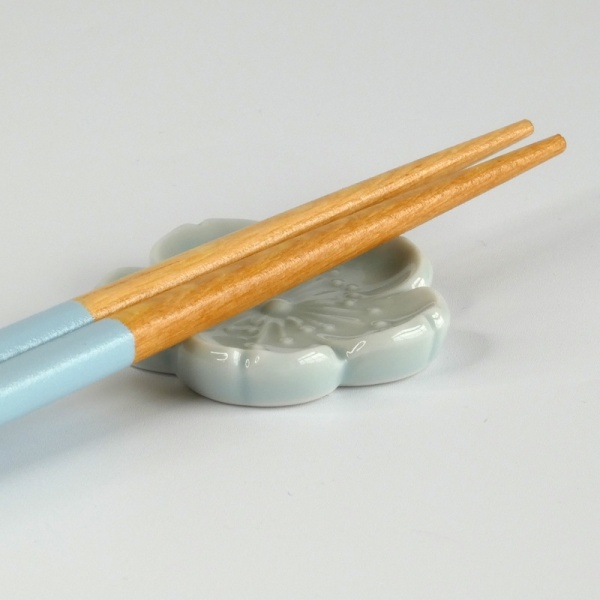 Pale blue Japanese wooden chopsticks with matching ceramic chopstick rest
