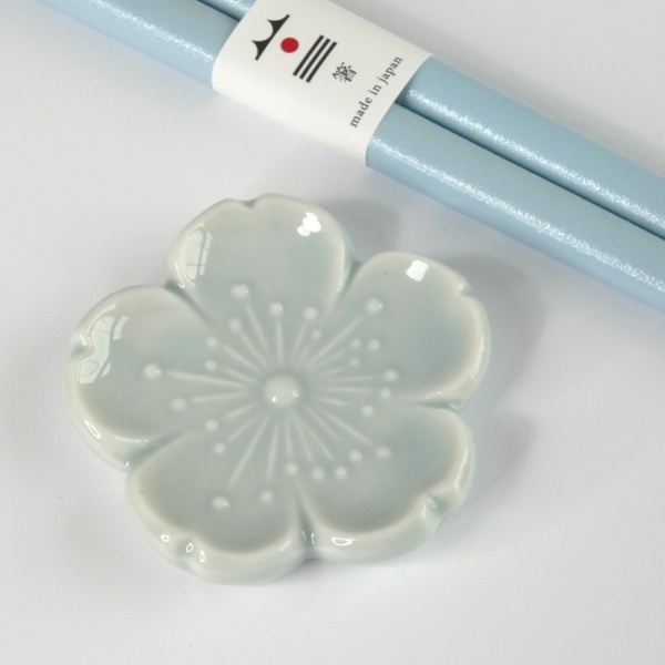 Close up of pale blue blossom ceramic chopstick rest