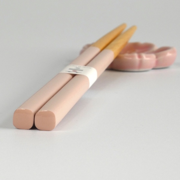 Close up of pastel pink chopstick handles