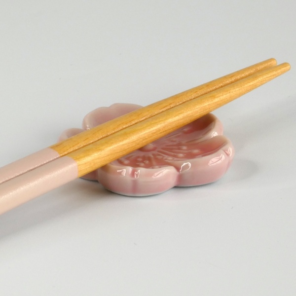 Pastel pink chopsticks and chopstick rest