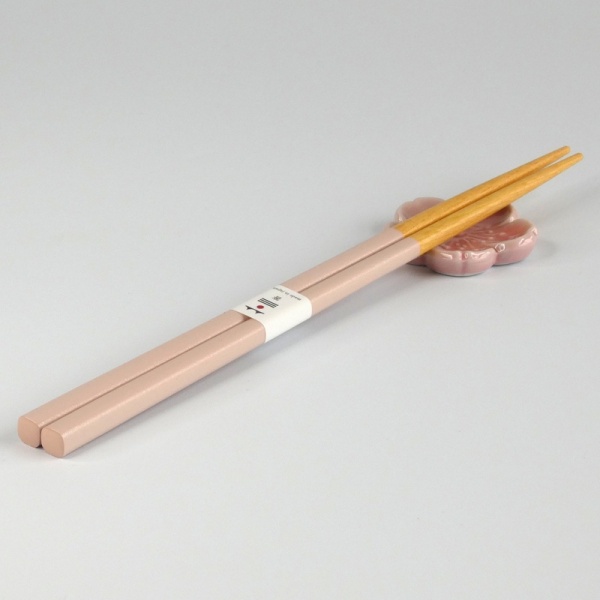 Pastel pink chopsticks with matching pink flower shaped chopstick rest