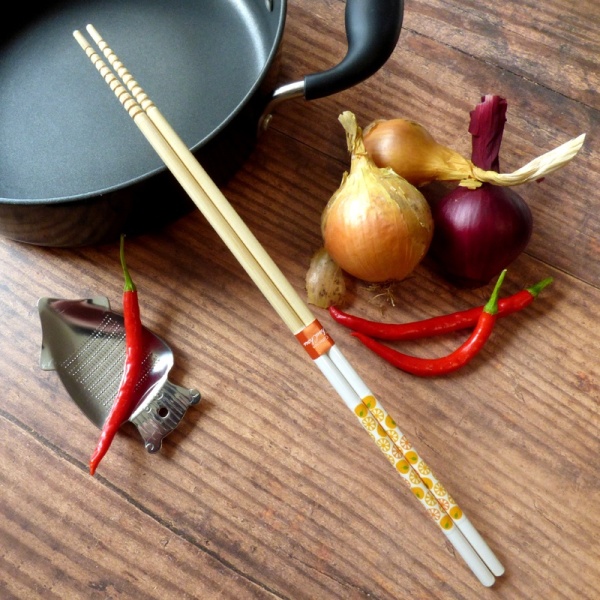 Yellow Citrus Japanese cooking chopsticks with cooking pot and ingredients