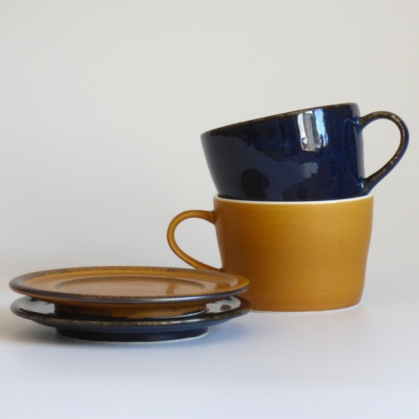 Dark blue and caramel coloured Japanese cups and saucers