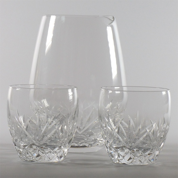 Cut glass sake serving jug and two small glasses