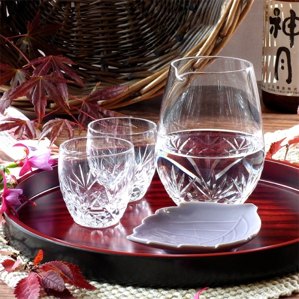 Cut glass sake jug and glasses set on serving tray