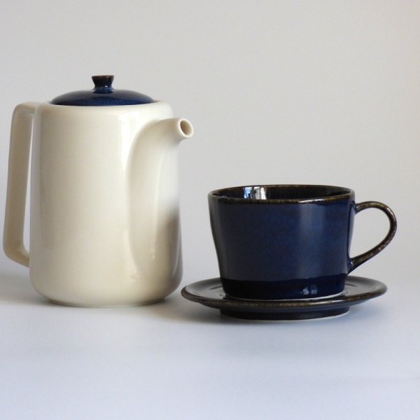 Dark blue Japanese cup and saucer with tall Japanese teapot