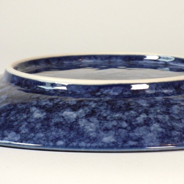 Close up of mottled blue glaze