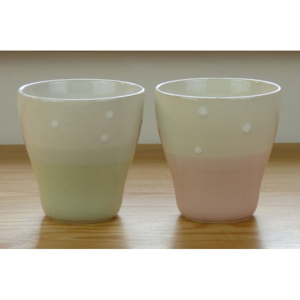 Pair of traditional Japanese teacups, green and pink