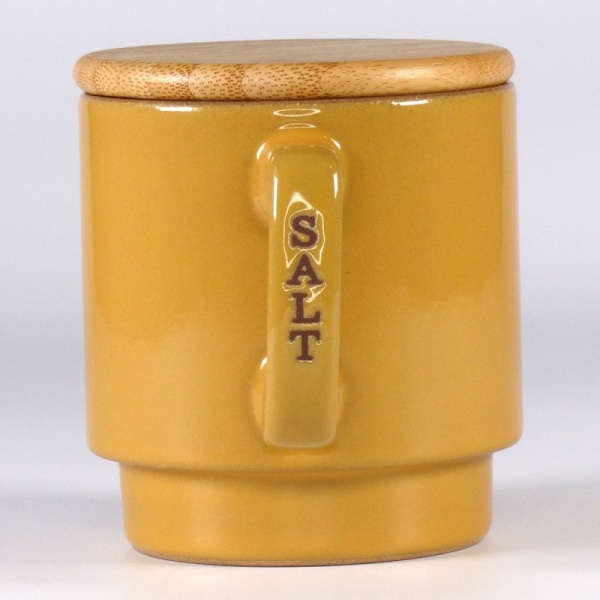 Mustard coloured ceramic storage container for salt