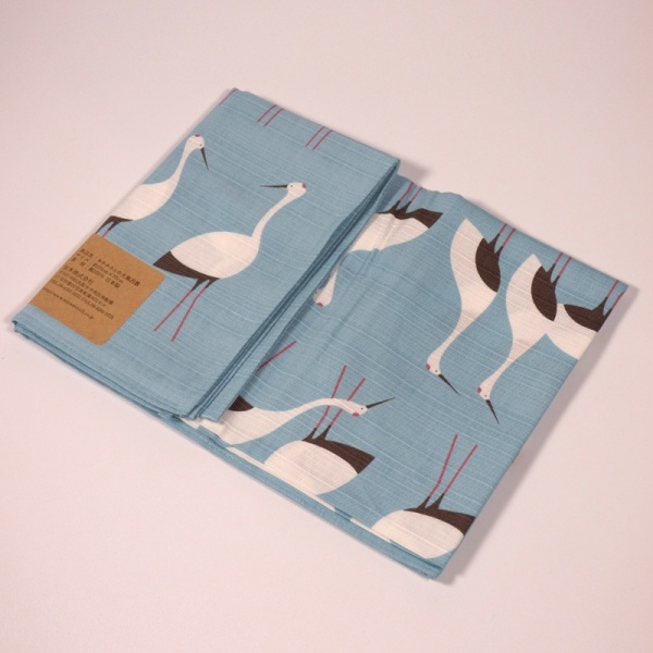 Pale blue furoshiki wrapping cloth with white crane design