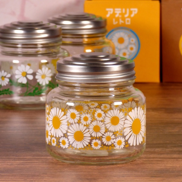 Three glass storage jars in kitchen setting