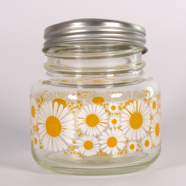 Retro style glass storage jar with bright daisy pattern
