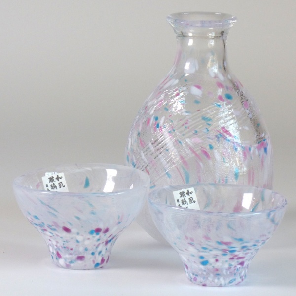 Two speckled glass Japanese sake cups with matching serving jug