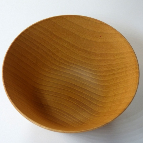 Interior surface of natural light wood Japanese bowl