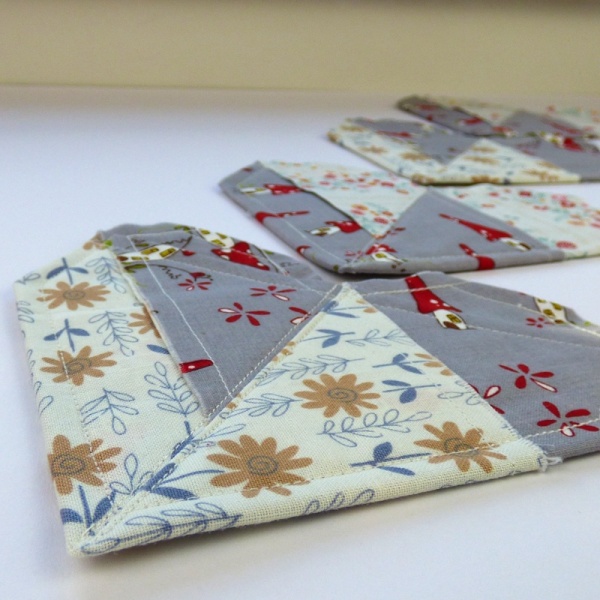 Origami Heart coasters in grey folksy fabric
