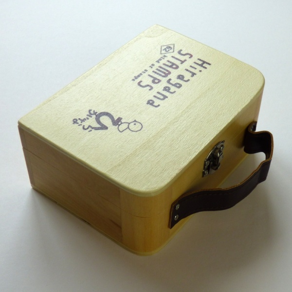 Wooden case containing hiragana stamps