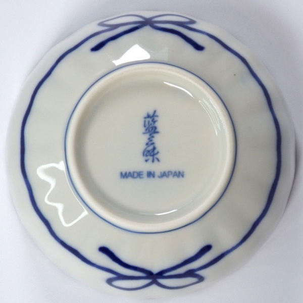 Underside of small Japanese bowl showing ribbon decoration